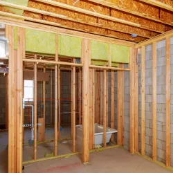 A basement undergoing remodeling with a bathroom addition